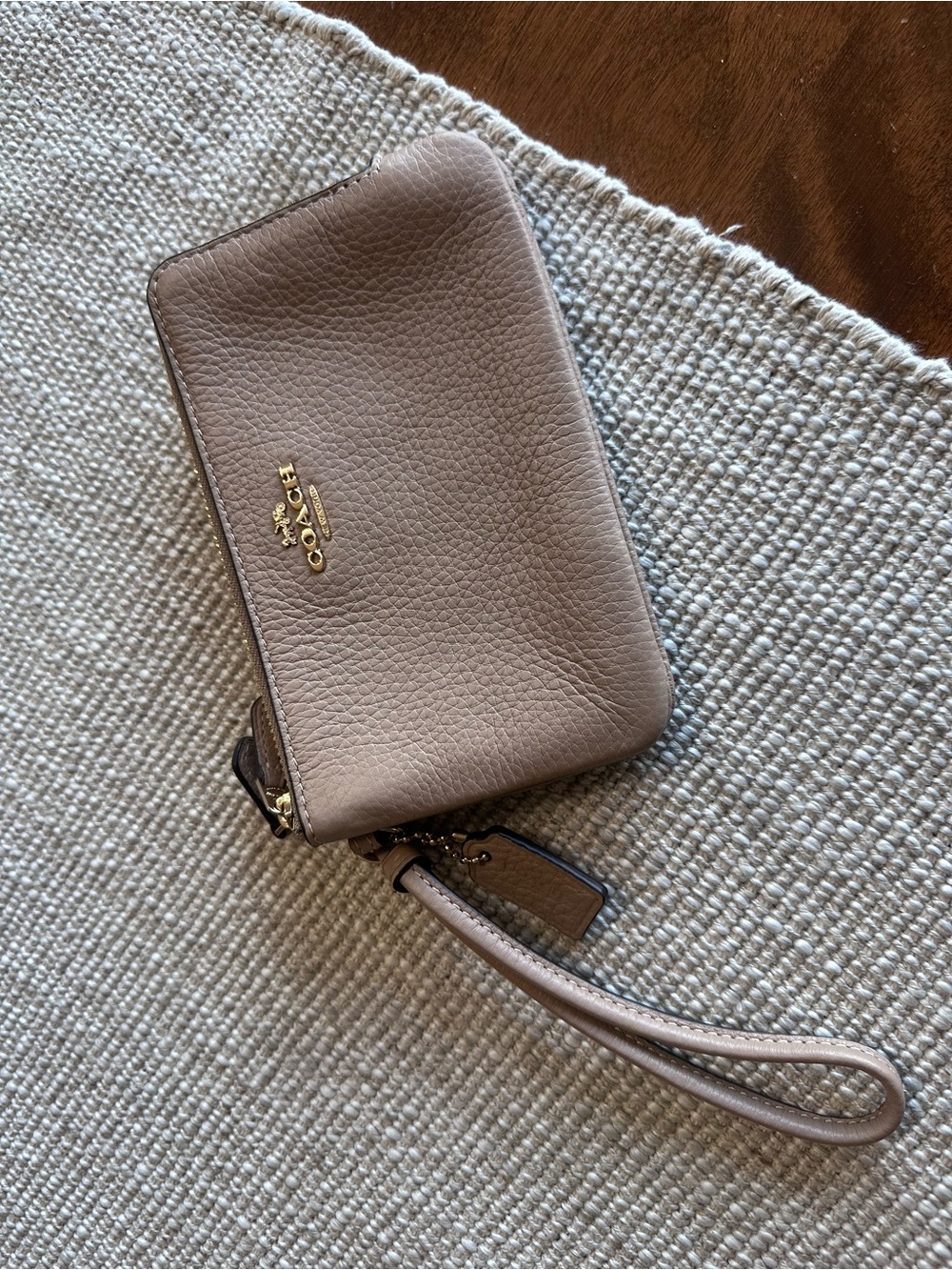 Coach Pebbled Leather Wristlet in Taupe NWT (tags not attached). Never used.